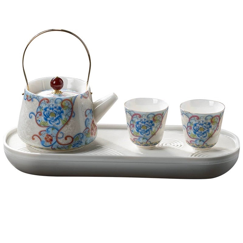 Delicate teapot and teacups